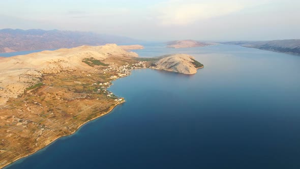 Flying above barren landscape of Pag island