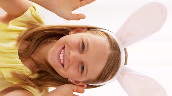 Girl in Easter Bunny Ears Playing Peek a Boo Game