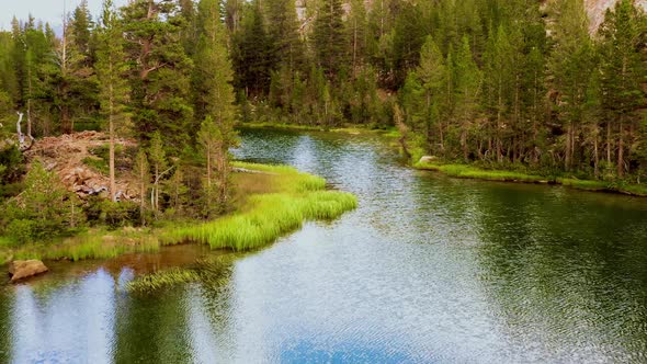 Flying over a beautiful and peaceful mountain lake in California