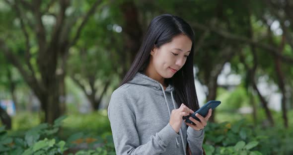 Woman Use of Mobile Phone in The Park