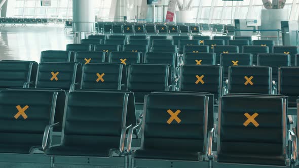 Seats at the Airport Marked for Social Distancing
