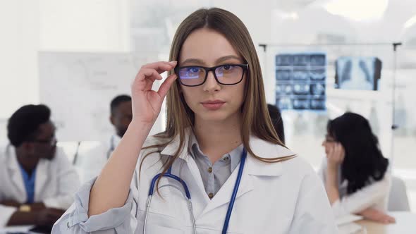 Portrait of Confident Female Medical Doctor in Glasses