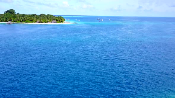 Sunny panorama of exotic seashore beach trip by water with sand background near reef