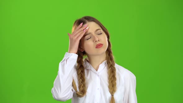 Girl Has a Headache. Green Screen