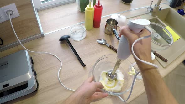 POV of Man Blending Soft Butter with Sugar