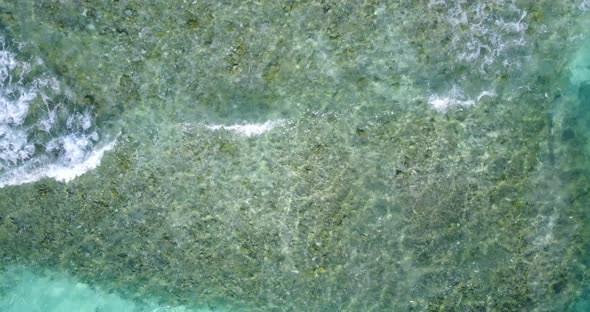 Luxury aerial clean view of a sunshine white sandy paradise beach and aqua blue water background in 