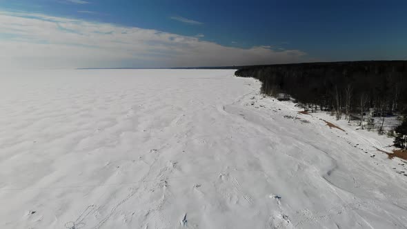 Coast Gulf Lake Sea in Ice with Snow