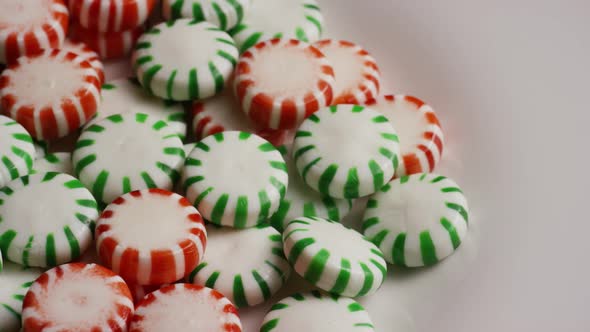 Rotating shot of spearmint hard candies - CANDY SPEARMINT 081