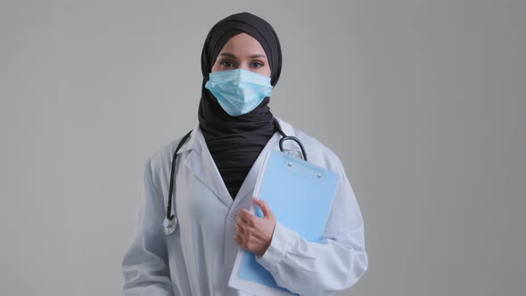 Portrait of Muslim Arabian Woman Female Doctor Surgeon Healthcare Professional Nurse in Hijab