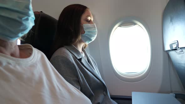 Airplane Passengers are Flying in Medical Masks