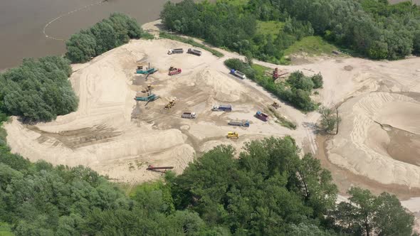 Mining conveyor at sand quarry. Aerial view of mining machinery. Mining industry