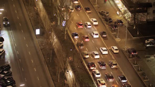 Night Traffic Cars on the Street Road in a Busy City Urban View