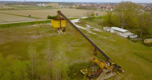 Steel Containers with Conveyor Belt Near a River