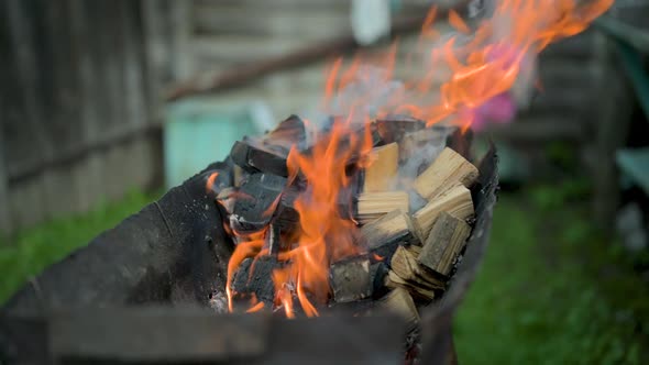 Firewood Is Burning in the Barbecue Grill.