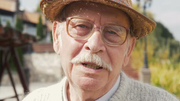 Happy portrait of senior man outdoors