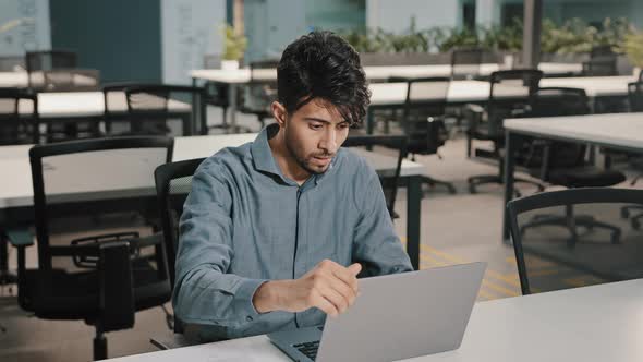 Young Man Arabian Worker Businessman Indian Man Entrepreneur Typing on Laptop Keyboard Copy Text in