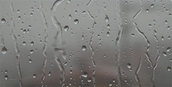 Raindrops on Window with City Landscape