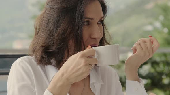 Closeup Portrait of Female Friends Chatting and Drinking Coffee in Outdoors Cafe Restaurant Rbbro