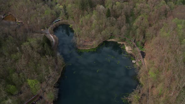 Ursu Lake (Bear Lake) Surrounded With Trees In The Forest In Sovata, Romania. - aerial