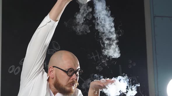 An Amazing Chemist Showing Experiments Uses Liquid Nitrogen He Pours It on His Hands and It Turns