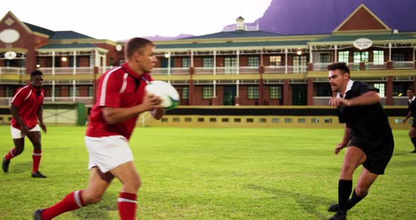 Male rugby players playing rugby in the stadium 4k