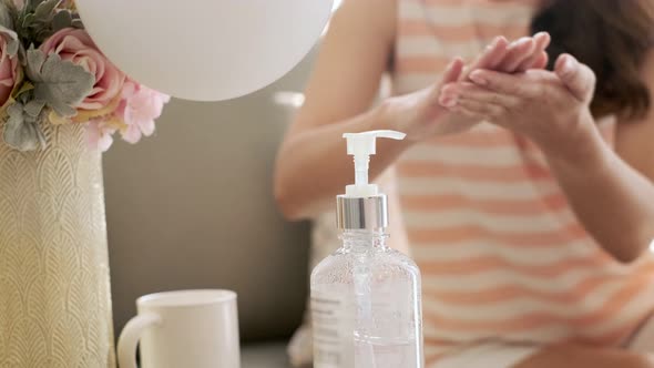 Woman housekeeper in mask cleaning at home. Close up of maid