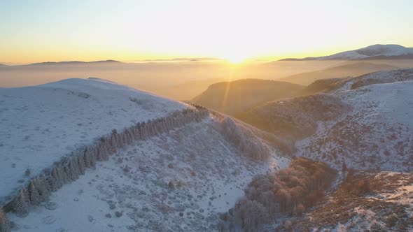 Mountain Road at Sunset. Landscape of Misty Snowy Mountains at Sunset 