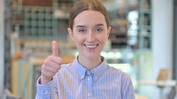 Portrait of Thumbs Up By Optimistic Young Businesswoman