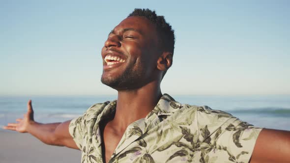 African American man enjoying the fresh air at the beach