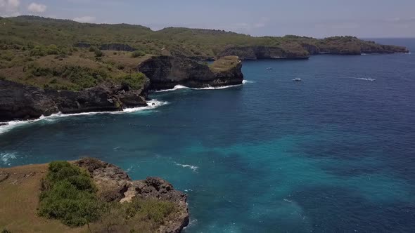 Calmer aerial view flight panorama overview drone shot ofBroken Beach at Nusa Penida in Bali Indone