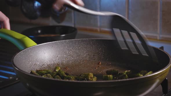 Cooking And Stirring Asparagus With Seasonings In A Skillet, Then Pour Eggs. close up