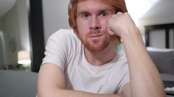 Close Up of Sitting Casual Redhead Man