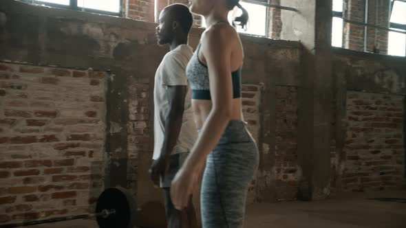 Sport people doing squat exercise workout at gym indoor. Fitness