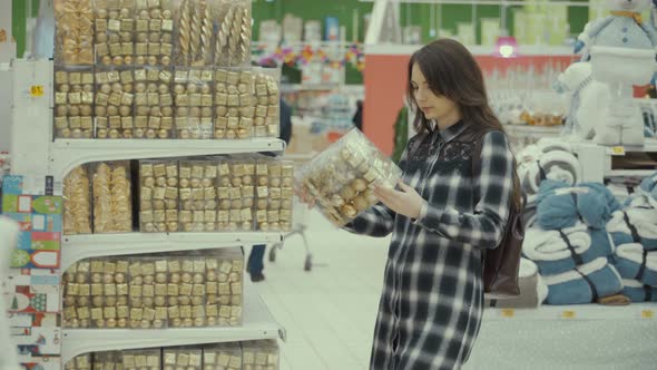 Pretty Woman Buying Christmas Decorations