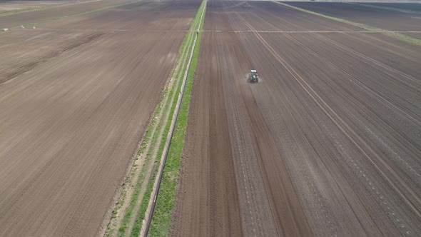 Tractor Harrows Farmland