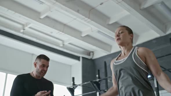 Personal Coach Yelling at Woman While She Skipping the Rope