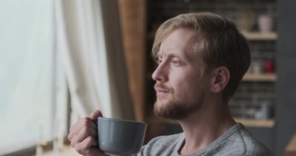 Pensive Stylish Man Dreaming Thinking About Future Drinking Hot Beverage From Mug Close Up