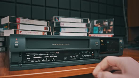 Insert VHS Cassette Into VCR and Push Play Button