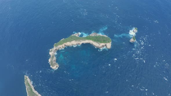 Aerial View of Small Wild Deserted Islands Surrounded By Blue Water of Ocean