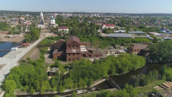 Aerial view of old red brick factory with an iron roof on the outskirts of the city 12