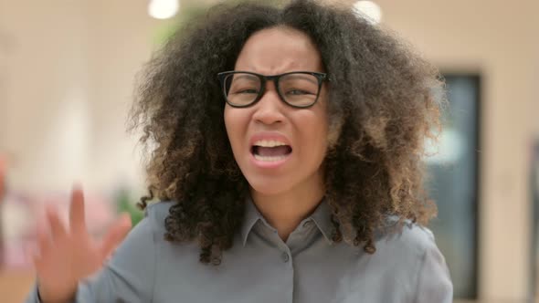 Portrait of Young African Woman Angry on Video Call