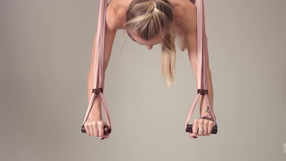 Adorable Woman Yoga Trainer During Aerial Yoga Master Class 