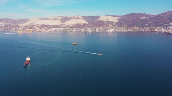 Motion Over Freight and Tourist Ships Crossing Azure Ocean