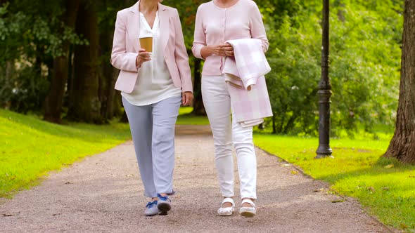 Senior Women or Friends Drinking Coffee at Park