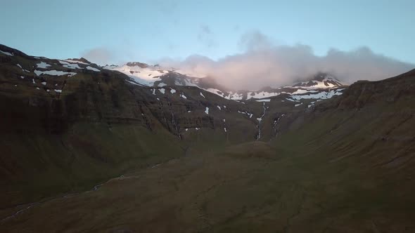 Perfect drone movement catching a sunset in a spectacular icelandic valley. shot in 4k with the mavi