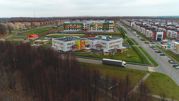 Building of Kindergarten with Playground Near Dwelling Block