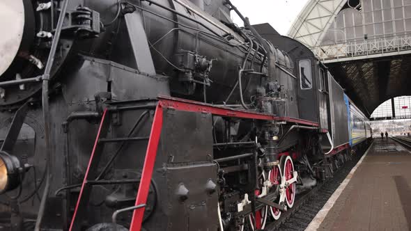 Retro Steam Train Departs From the Railway Station