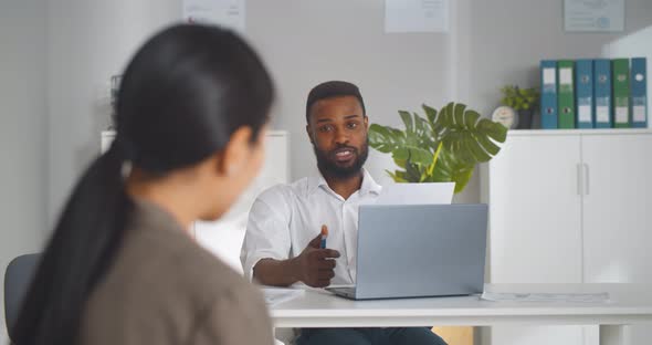 Human Resources Manager Communicating with Vacancy Applicant