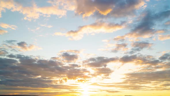 Clouds Fly Across the Sky at Sunset