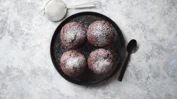 Fresh and Tasty Chocolate Muffins Served on Plate